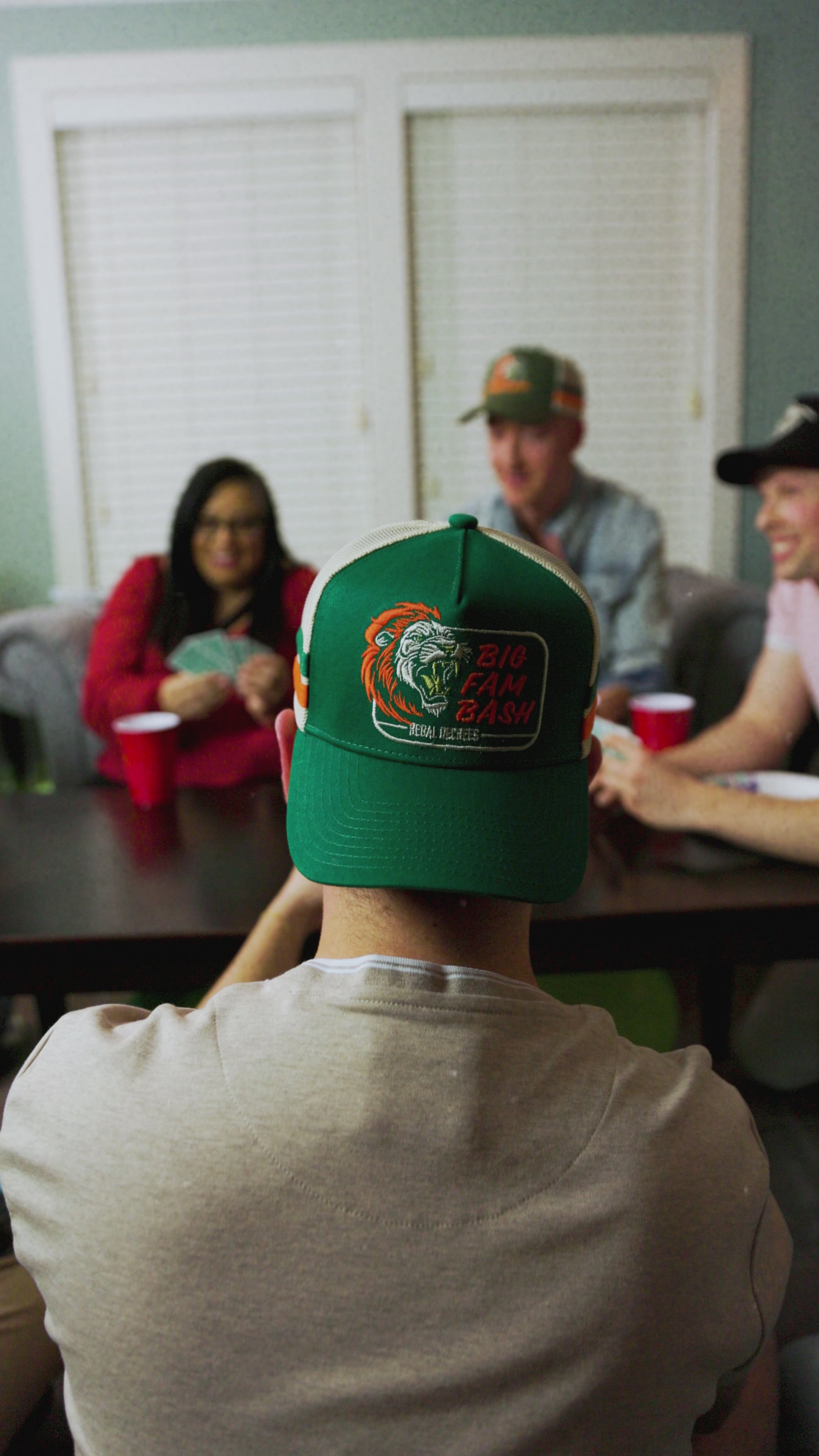 Friends playing a card game, Fam Bash Hat Closeup Video